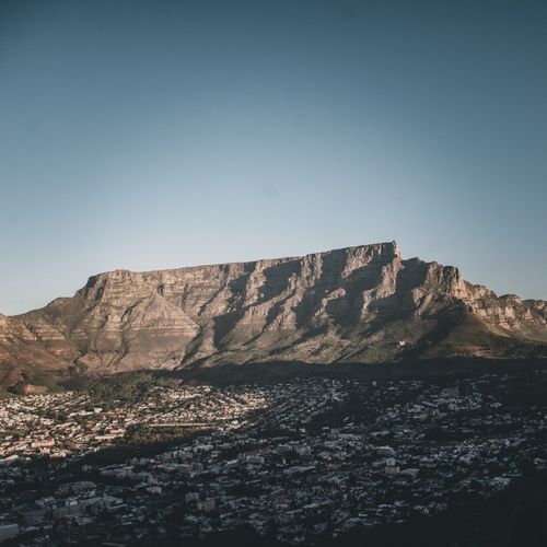 Free Stunning aerial shot of Table Mountain with Cape Town below, showcasing natural beauty at sunrise. Stock Photo