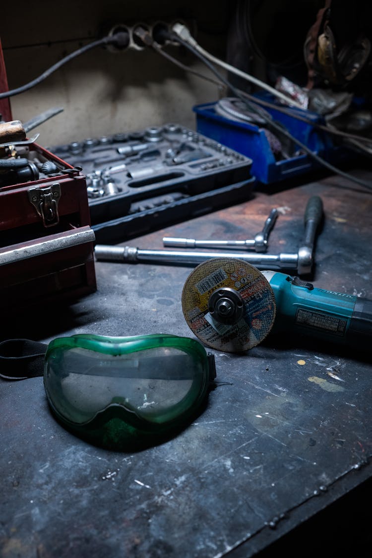 Car Mechanic Tools On A Metal Surface