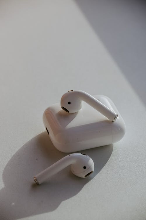 AirPods on White Surface