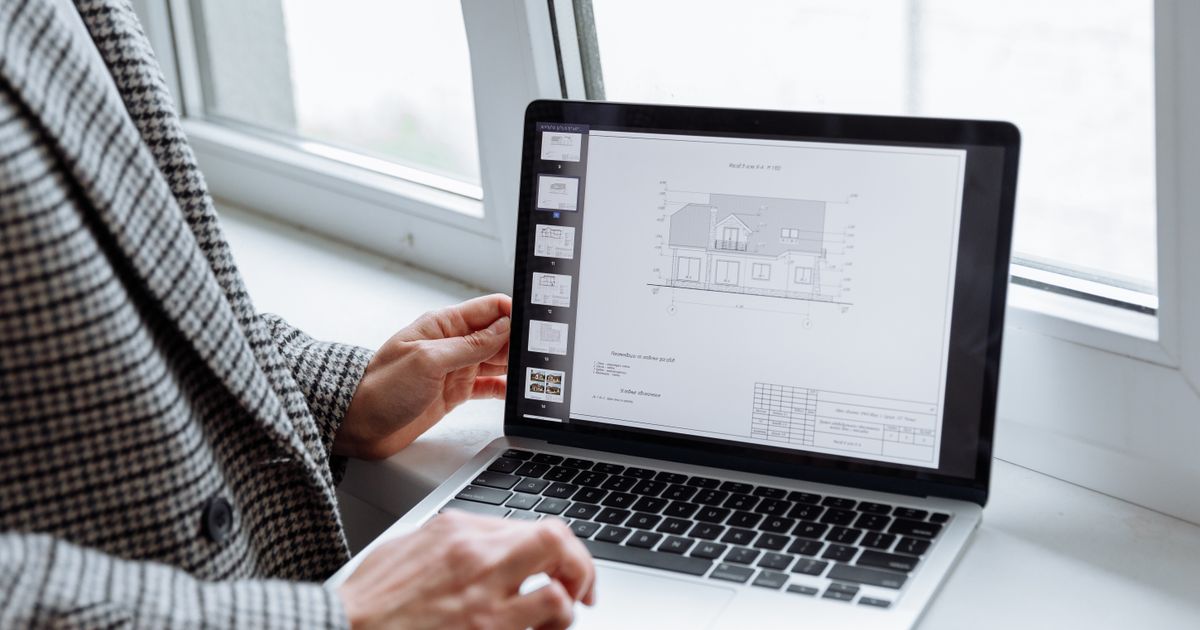 Transferable Skills: Professional drafting green building designs on a digital tablet.