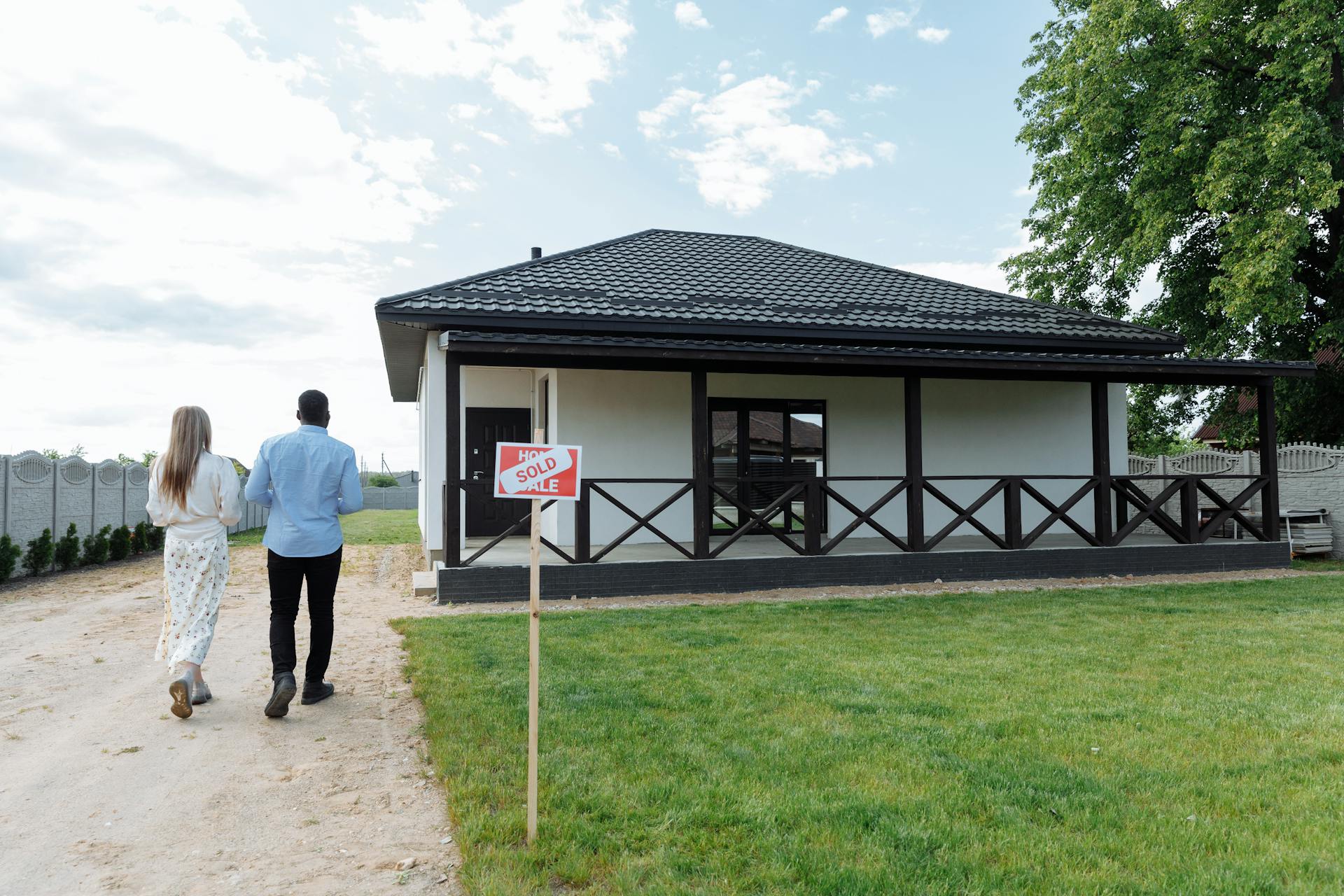 Couple Walking towards Their New House