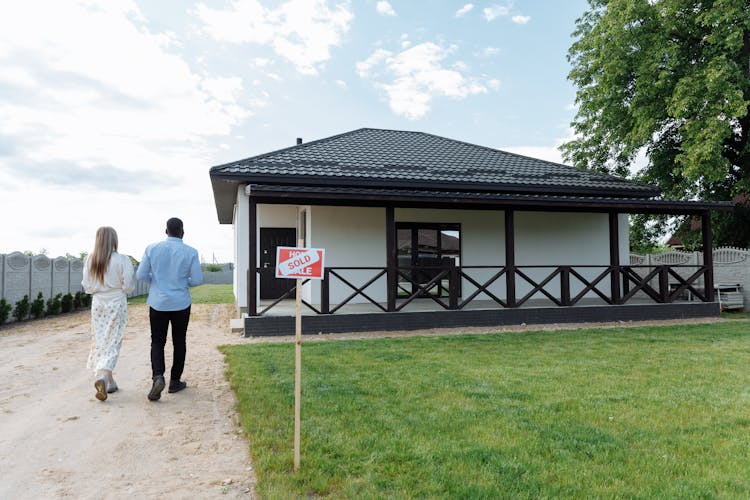 Couple Walking Towards Their New House