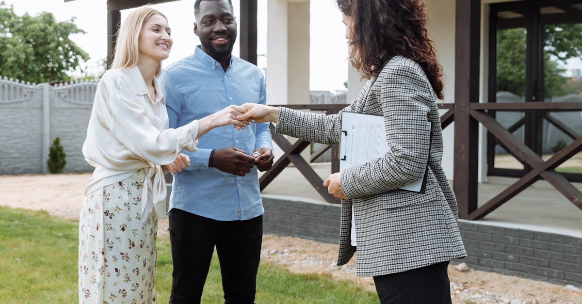 Photo by Thirdman A realtor finalizes a home sale with a handshake agreement, welcoming new homeowners to their property.