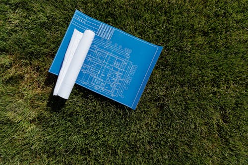 Blueprint on a Grassy Ground