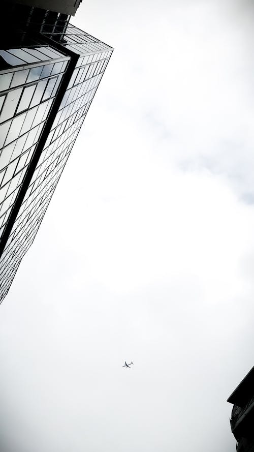 Free Grayscale Low Angle Photography of a High Rise Building Stock Photo