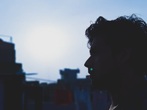 Man Face With a Background of Buildings