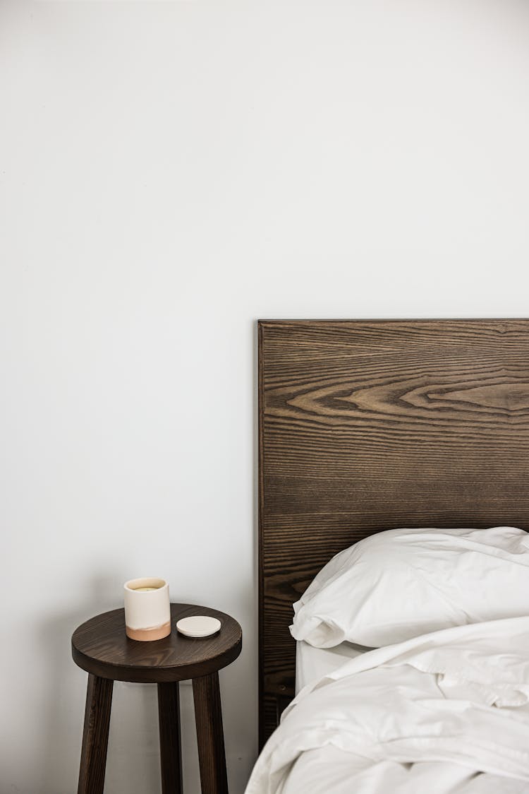 
Wooden Headboard Near The Bed