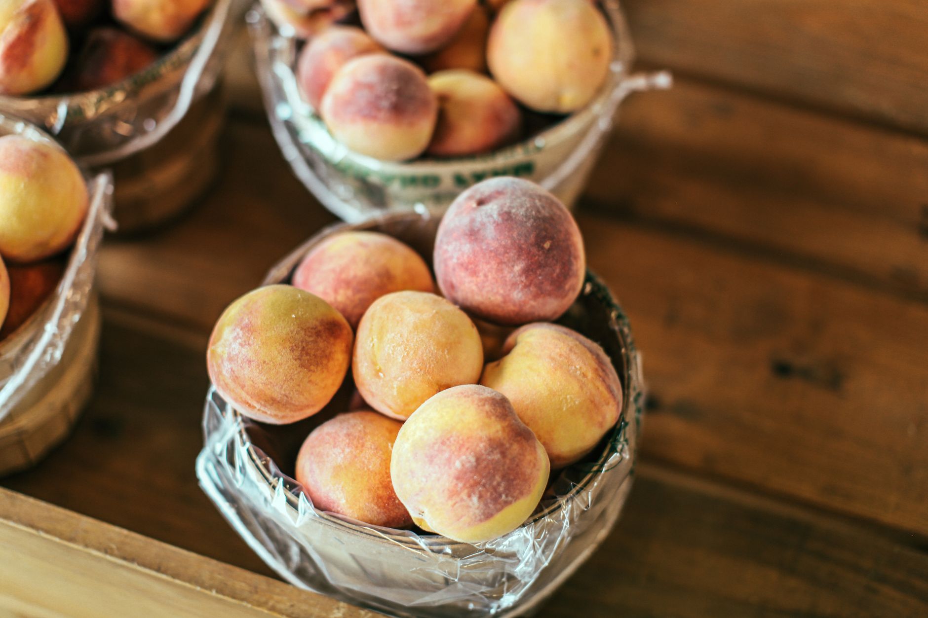 Close up of ripe peaches with fuzz on skin