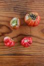 3 Red Tomato on Brown Wooden Table