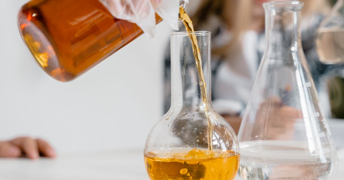 A curious child pours liquid into a flask during a science experiment indoors. - Evidence evidence guide for mct oil cognition randomized trial