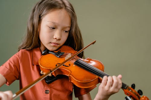 Free A Girl Playing a Violin Stock Photo
