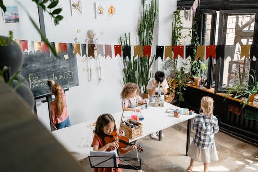 Engaging classroom where kids explore music and science, fostering curiosity.