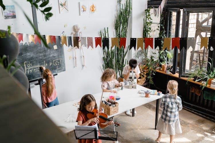 Kids Doing Different Activities Inside A Room