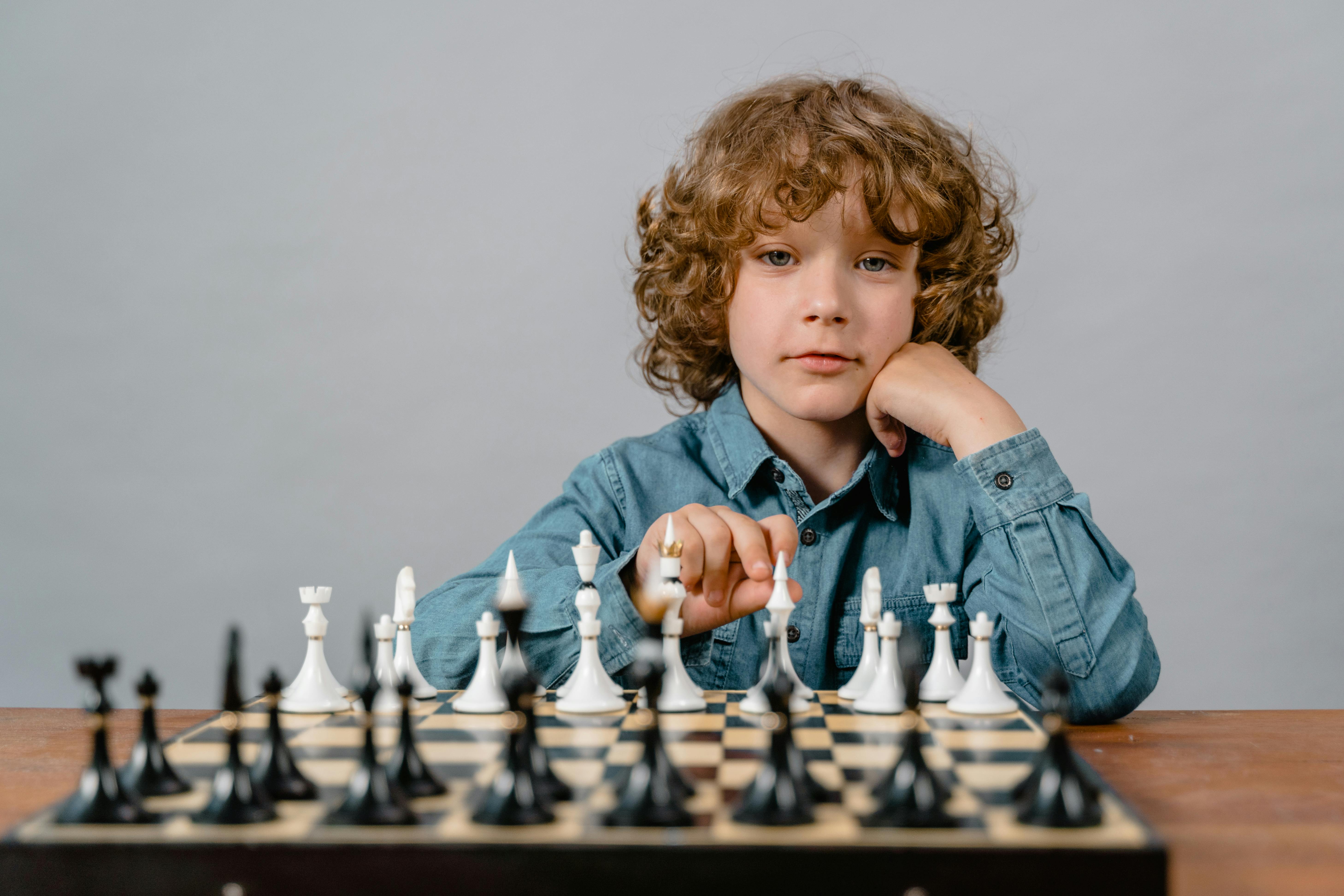 A Smart Boy Playing Chess Free Stock Photo   Pexels Photo 8471838 