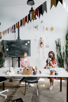 Children engaging in a science activity in a creatively decorated classroom.