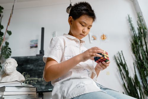 A Boy Solving a Rubik's Cube