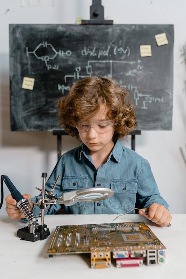 A Smart Boy Doing A Science Experiment