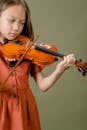 Girl in Red Dress Playing Violin