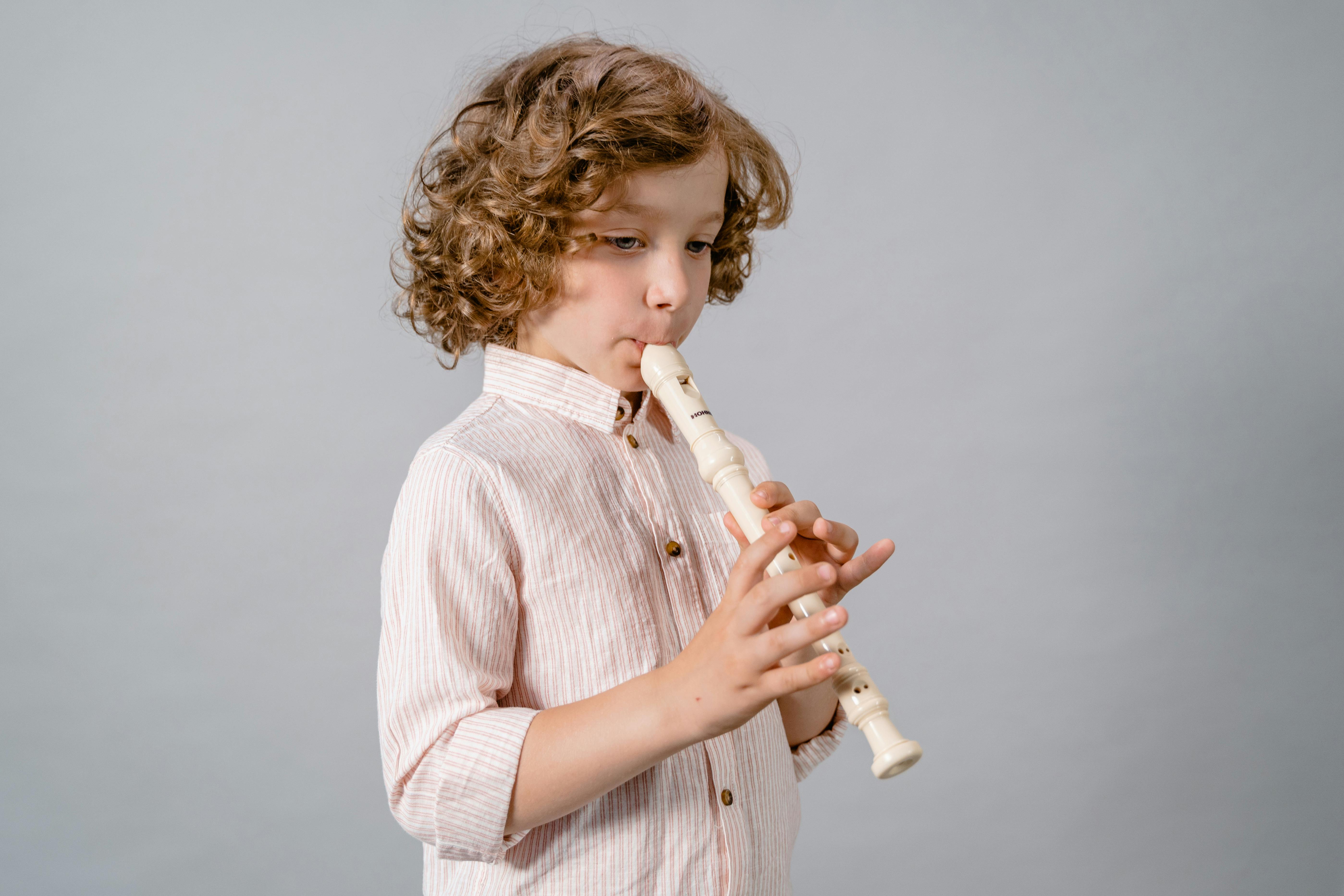 A Boy Playing Flute Free Stock Photo   Pexels Photo 8471916 