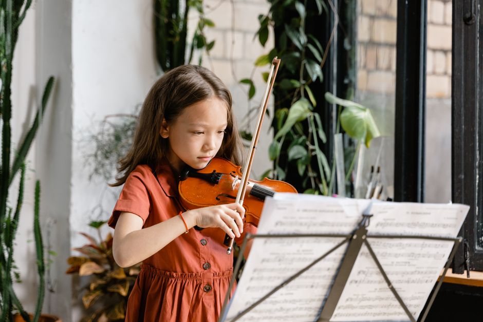 student playing violin in early childhood strings program student playing violin in early childhood strings program