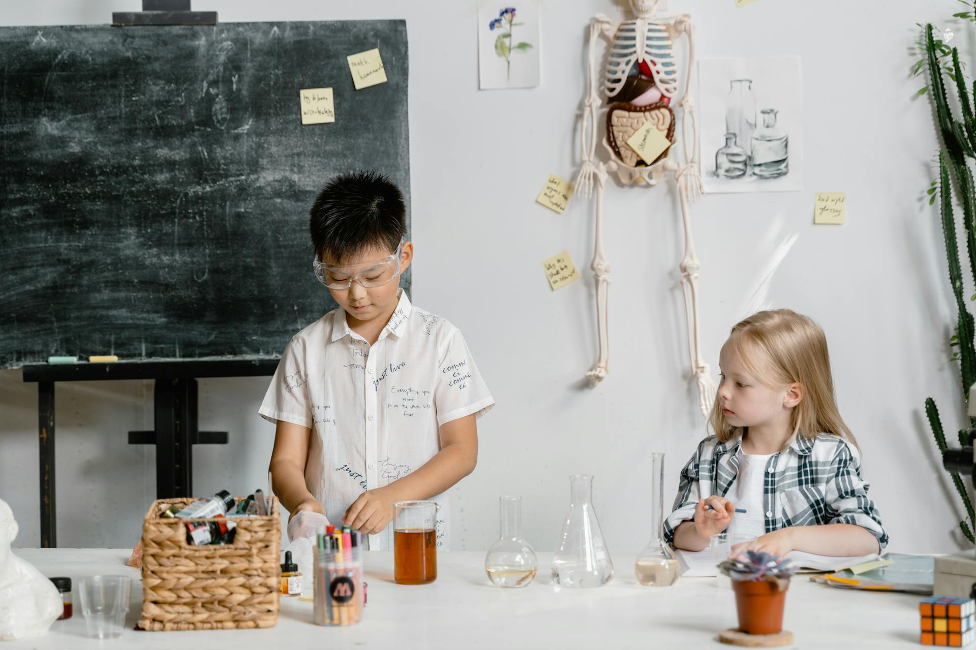 Students Experimenting Using Laboratory Equipment Inside the Laboratory