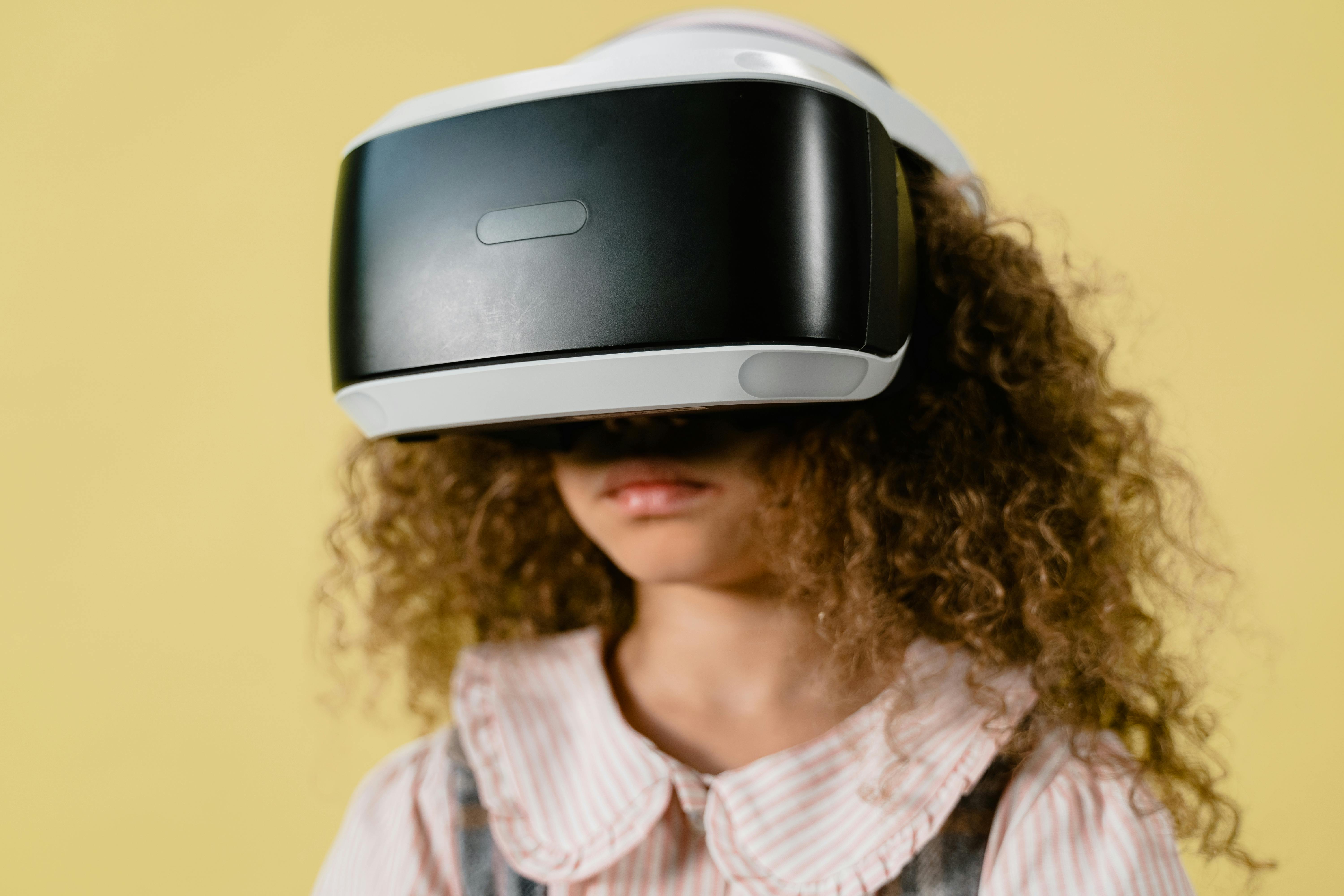 a person with curly hair using vr headset