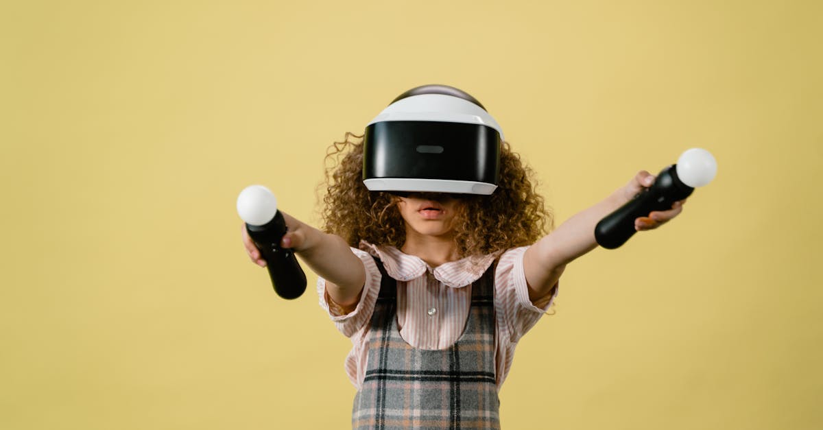 Girl immersed in virtual reality gaming with VR controllers and headset against a yellow background.