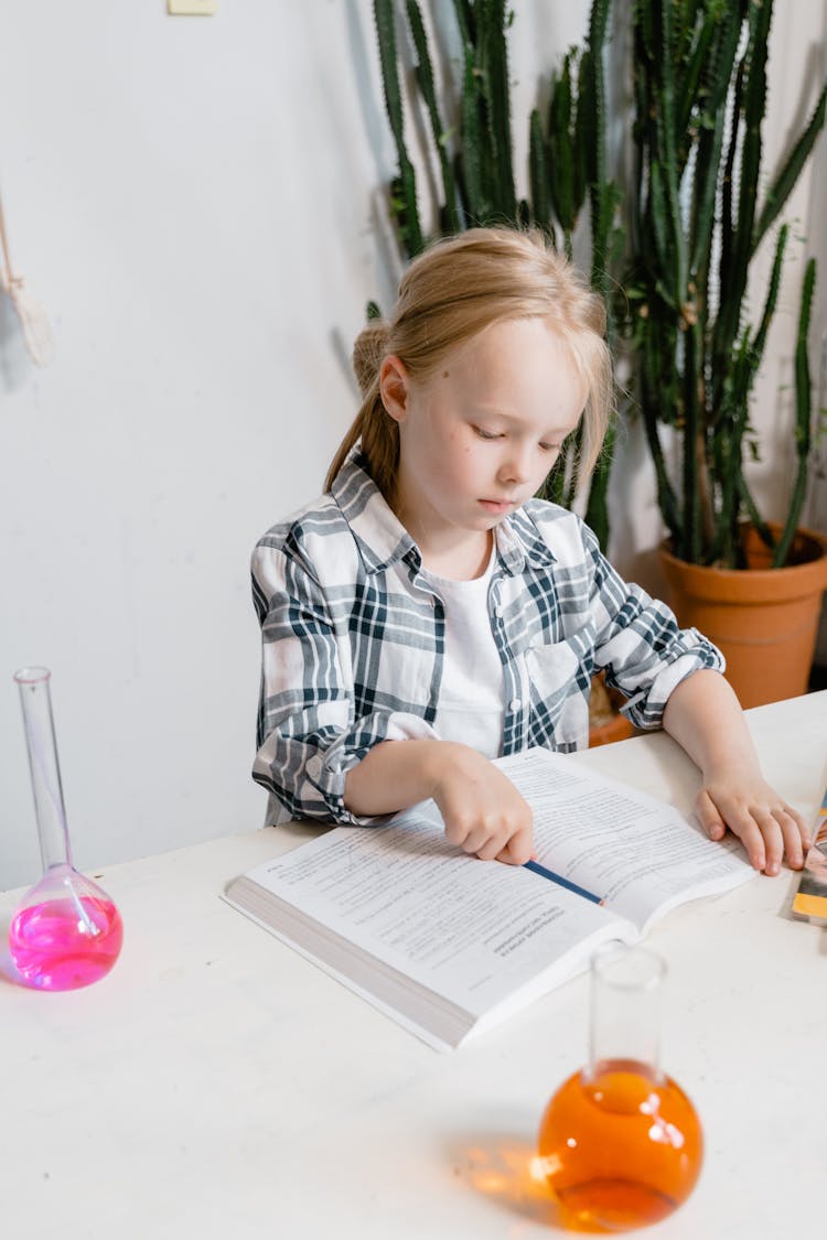 Smart Girl Reading A Textbook 