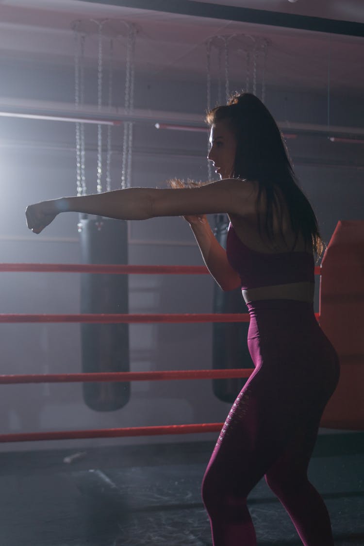 A Woman In Activewear Practicing Her Boxing Skills