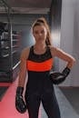 Woman in Black and Red Tank Top and Black Leather Boxing Gloves