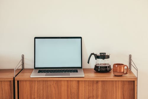 A Laptop on a Wooden Table