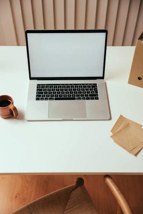 A Laptop on White Table