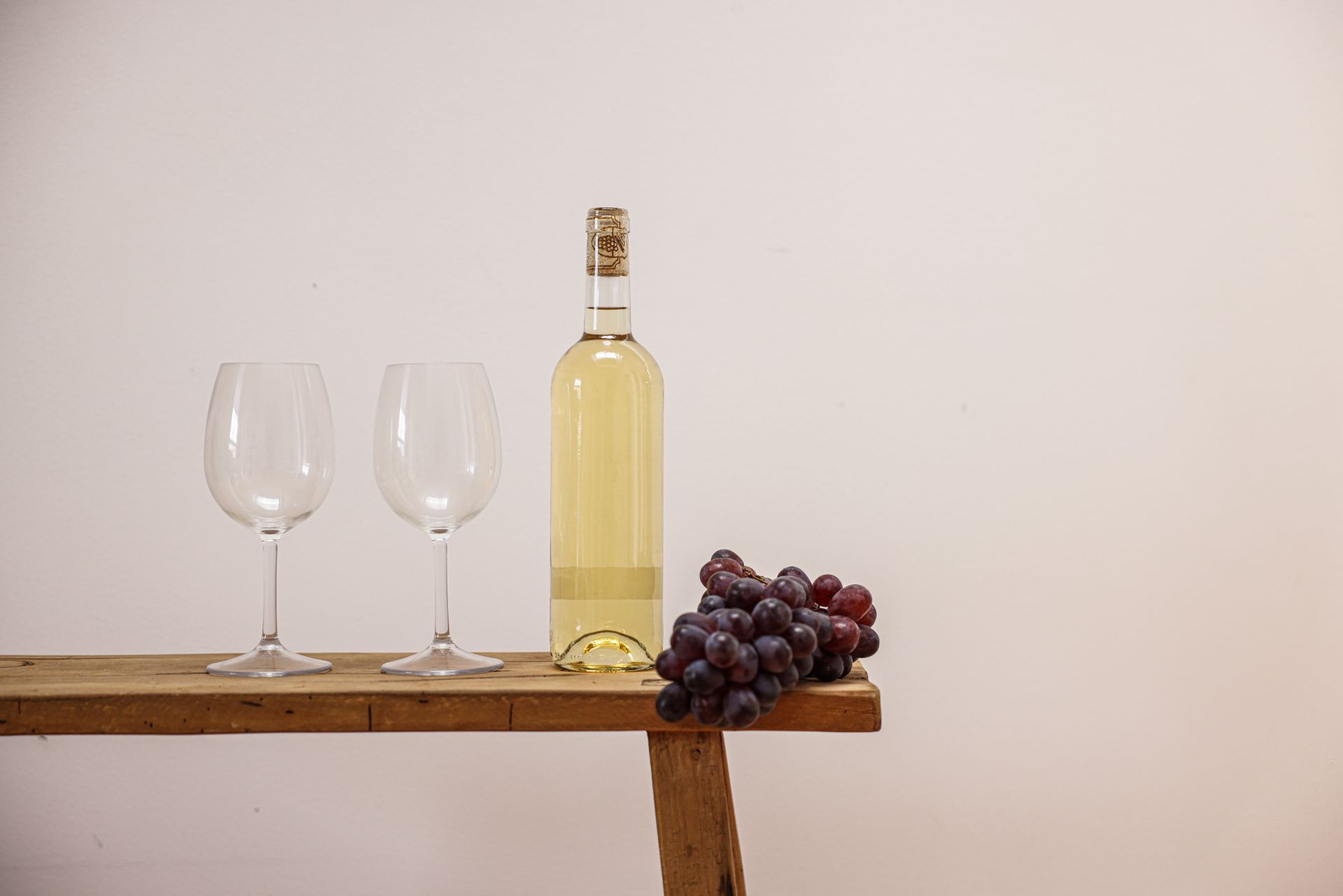 A Bottle of Wine and Grapes