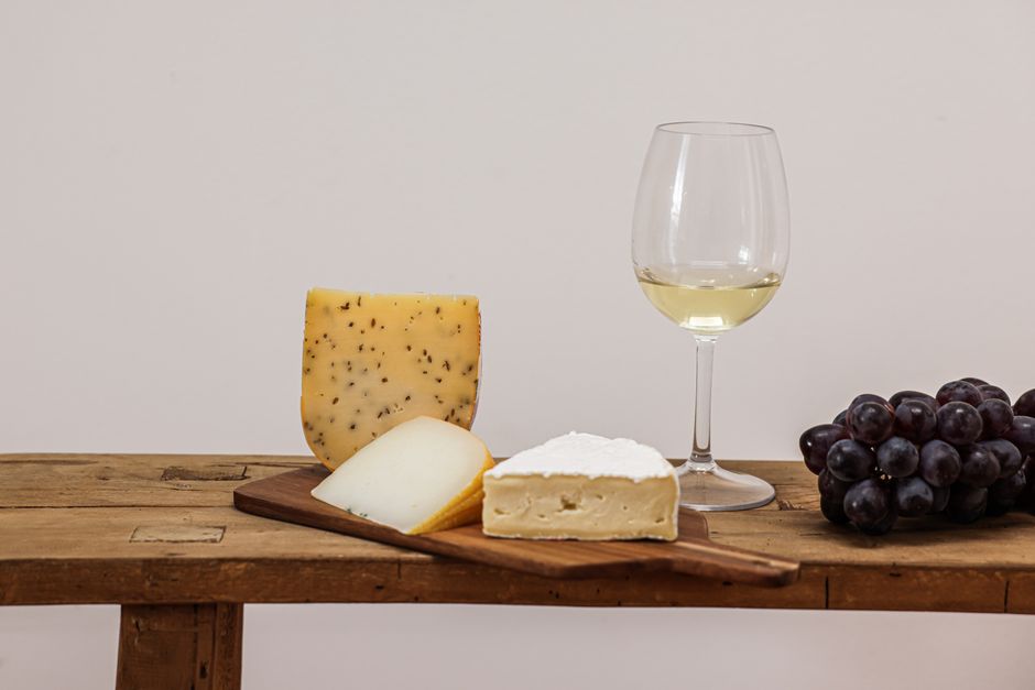 Fresh goat cheese served with a glass of crisp white wine