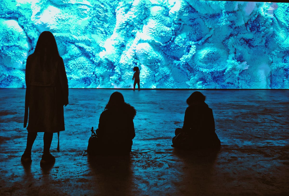 Peaceful minimalist desk setup with coffee, notebook, and laptop in natural light