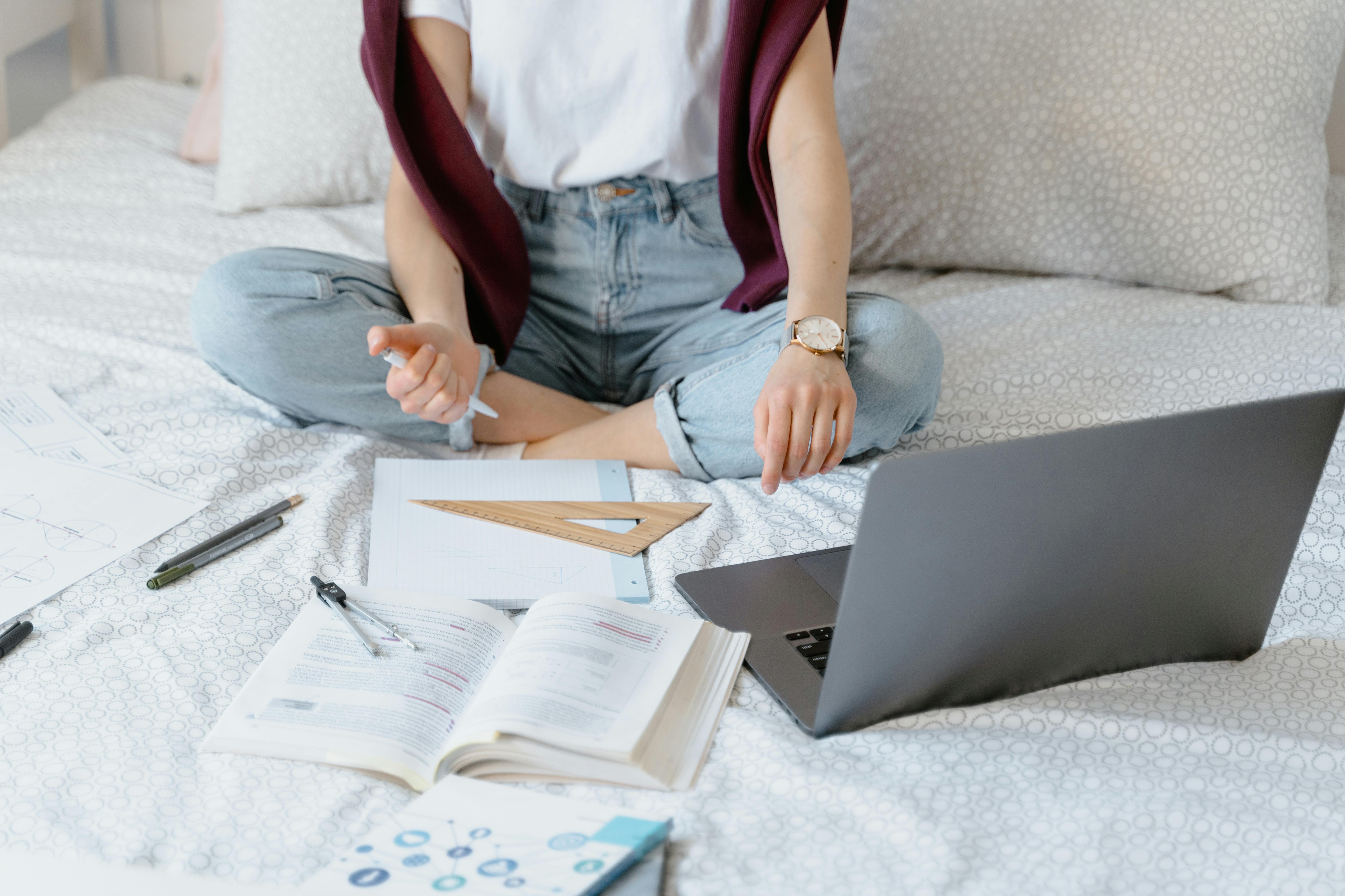 woman laptop bedroom pencil