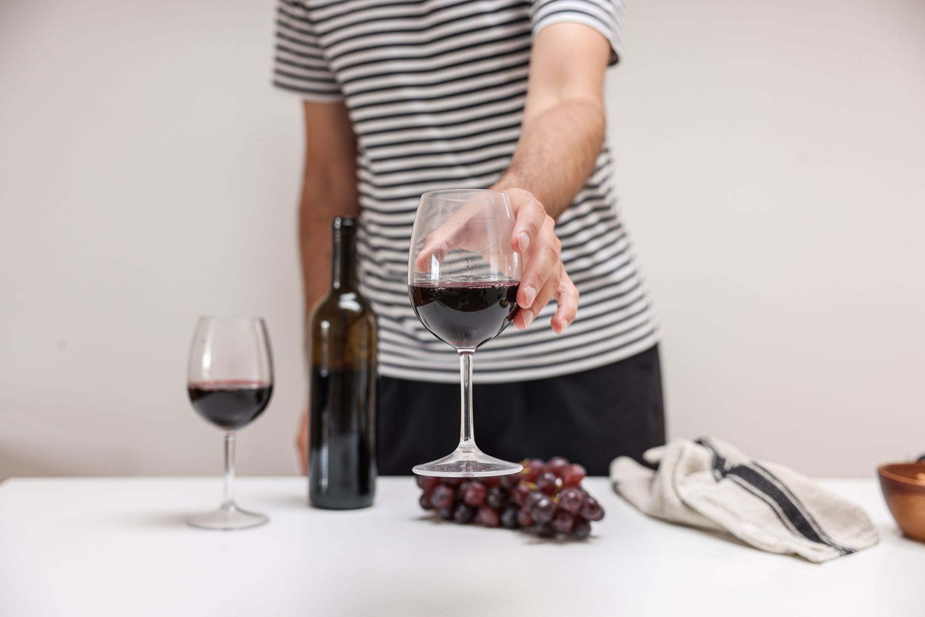 Elegant wine glass swirling showing aroma release