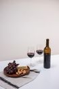 A Plate of Food and Glasses of Wine