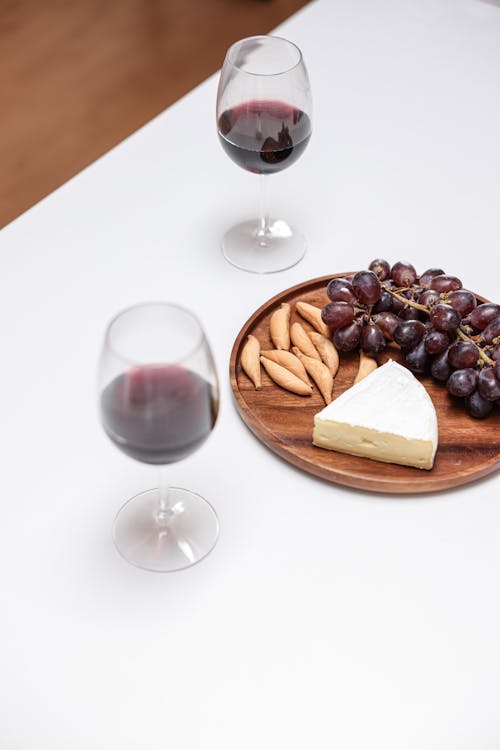 Free 
A Charcuterie Board beside Glasses of Wine Stock Photo