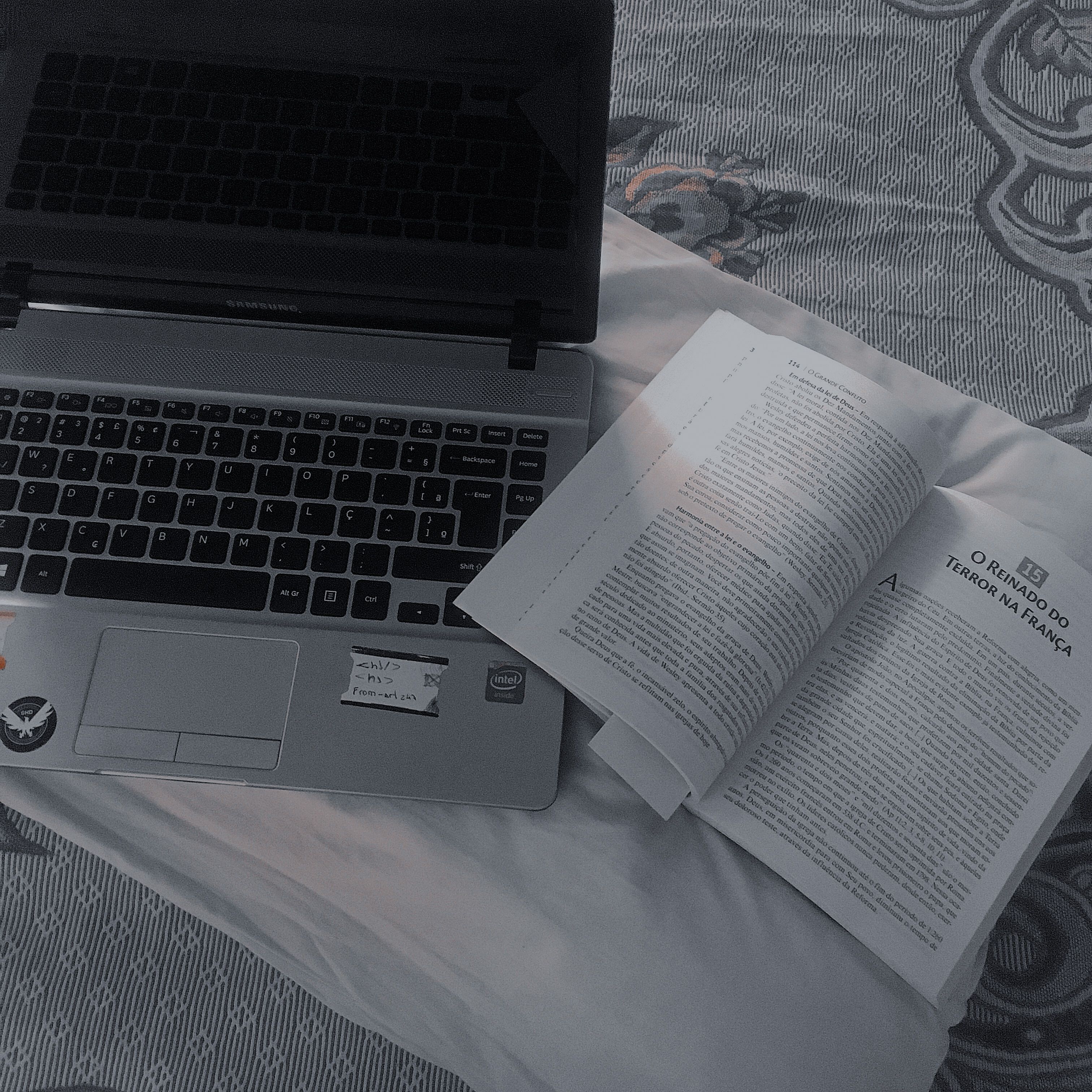 Book Beside a Laptop