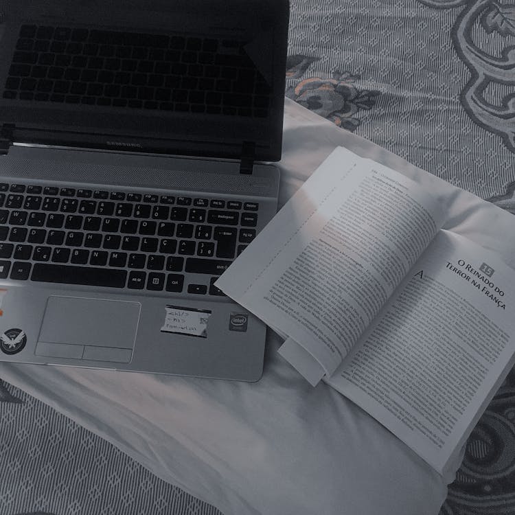 Book Beside a Laptop · Free Stock Photo
