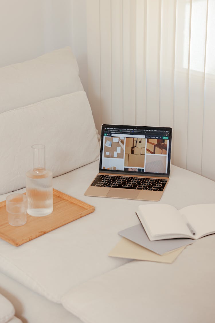 A Macbook On White Linen