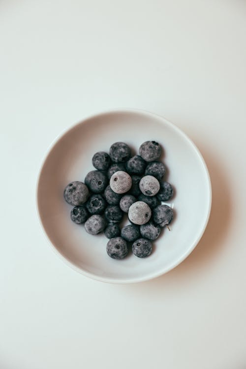 Fresh Huckleberries on a Ceramic Bowl