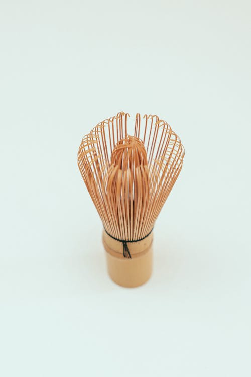 Bamboo Whisk on White Surface