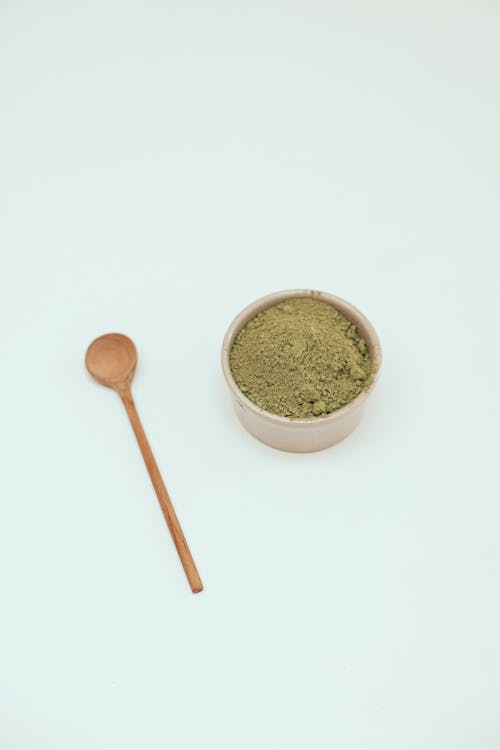 Free Match Powder on a Bowl and a Wooden Spoon Stock Photo