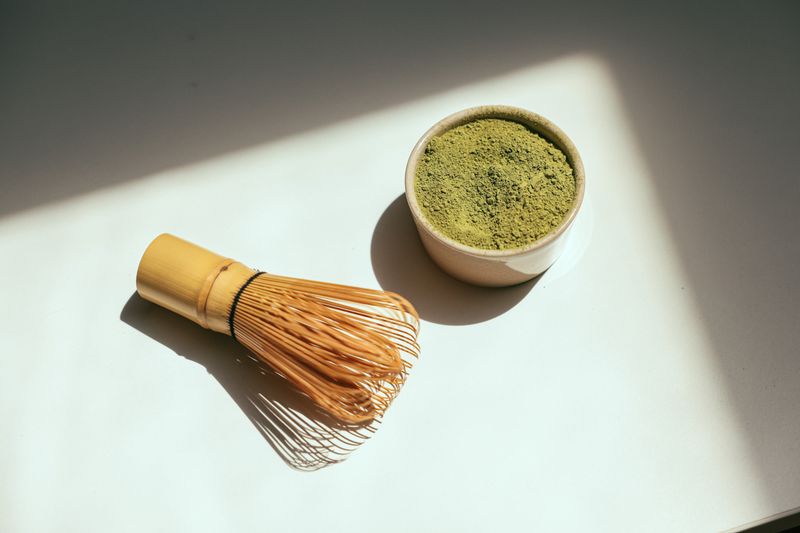 A bowl of bright green matcha powder