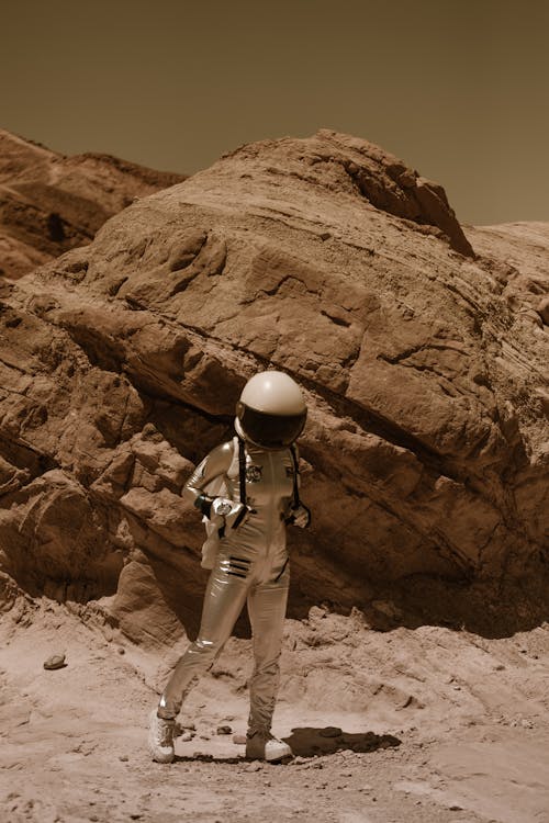 Astronaut in a Spacesuit Walking on the Mars Surface 