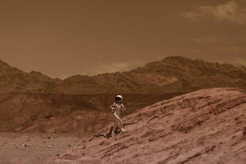 Astronaut in a Spacesuit Walking on Mars Surface