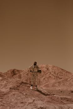 Astronaut in a space suit stands against a reddish desert background, resembling a Martian terrain.
