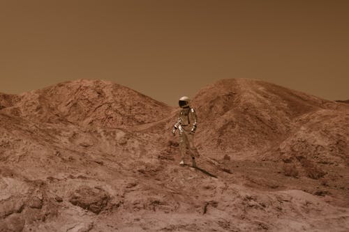 Astronaut in a Space Suit Walking on the Mars Surface 